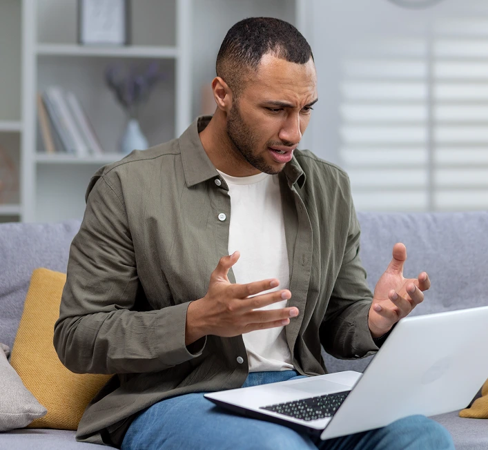 Man talking during a video call on his laptop – online psychiatry in Sacramento, CA